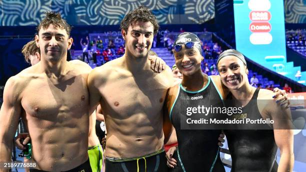 Leonardo Deplano, Lorenzo Zazzeri, Sara Curtis, Silvia Di Pietro of Italy pose for a picture after competing in the Mixed 4x50m Freestyle during the...