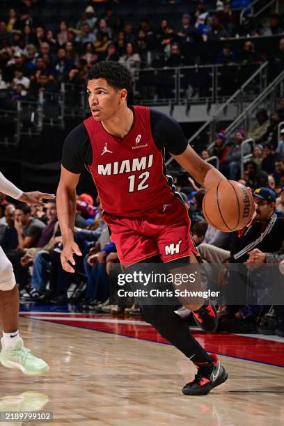 Dru Smith of the Miami Heat dribbles the ball during the game against the Detroit Pistons on December 16, 2024 at Little Caesars Arena in Detroit,...