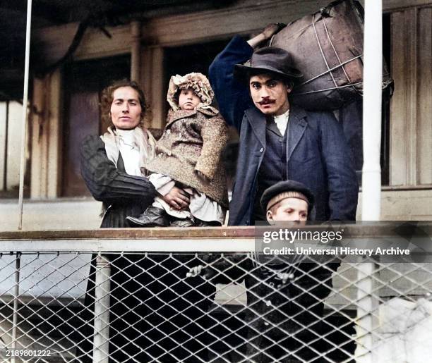 Italian immigrant family on ferry, leaving Ellis Island, New York City, New York, USA, Lewis Wickes Hine, 1905 .