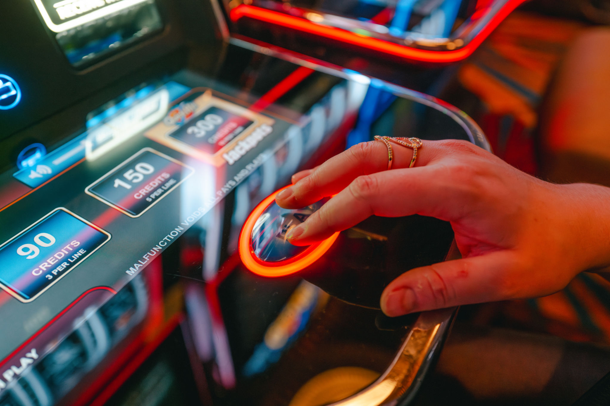 Casino Slot Machine - Play Button - Close Up - Hand Casino Slot Machine - Play Button - Close Up - Hand