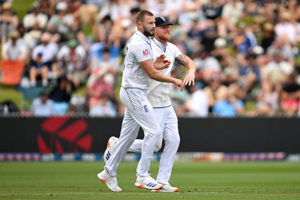Gus Atkinson and Ben Stokes of England celebrate after dismissing Will Young of New Zealand during day one of the Third Test Match in the series...