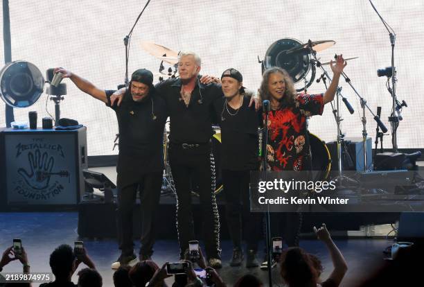 Robert Trujillo, James Hetfield, Lars Ulrich and Kirk Hammett of Metallica pose onstage during Metallica's All Within My Hands Foundation Presented...