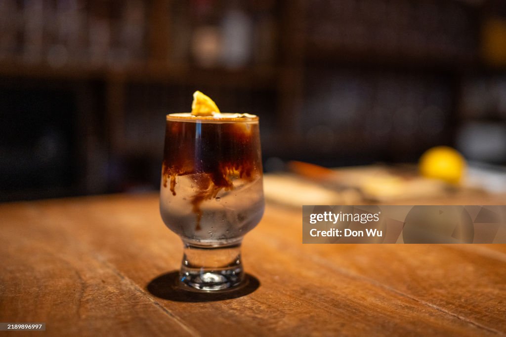 Lemon Lime and Bitters Drink on a Rustic Wooden Bar