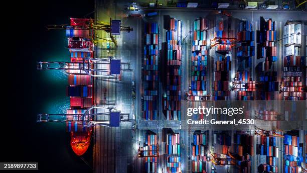 aerial top view container ship docked in port at night. - shipping container top view - fotografias e filmes do acervo