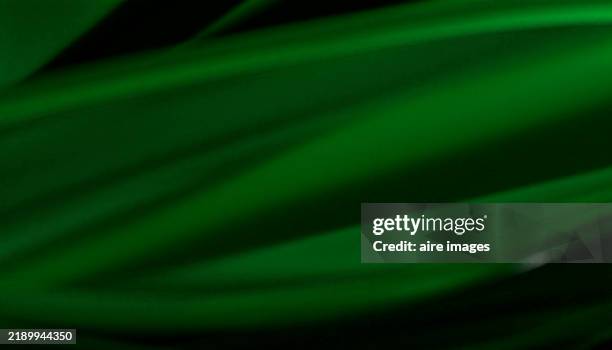 abstract green background with smooth lines flowing - green satin stock pictures, royalty-free photos & images