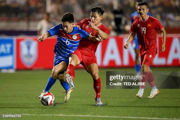 Sandro Reyes Philippines' Sandro Reyes vies for the ball with Vietnam's Thanh Binh ...