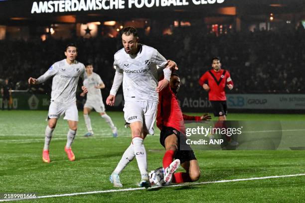 David Min of FC Utrecht, Ricardo van Rhijn of AFC during the KNVB Beker match between AFC and FC Utrecht at Sportpark Goed Genoeg on Dec. 18, 2024 in...
