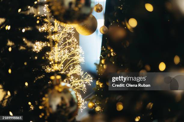 bright led tree among xmas trees with lights and toys. - holiday spirit stock pictures, royalty-free photos & images