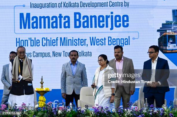 Chief Minister Mamata Banerjee lighting the lamp during the inauguration ceremony of the Infosys Development Centre in presence of CFO, Infosys...