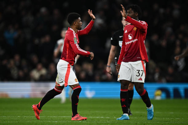 Amad Diallo of Manchester United celebrate with Kobbie Mainoo after scoring the goal during the Carabao Cup Quarter Final match between Tottenham...