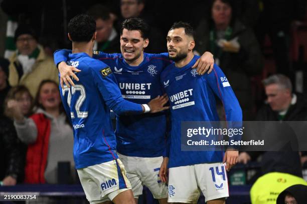 Nedim Bajrami of Rangers FC celebrates scoring his team's first goal with teammates Jefte and Ianis Hagi during the Premier Sports Cup Final between...