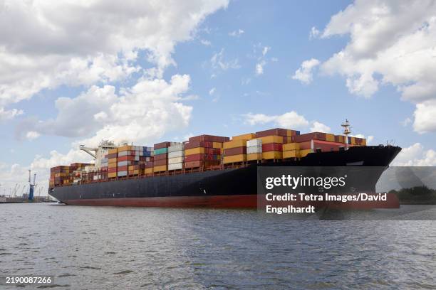 cargo ship with containers at dock - moored stock pictures, royalty-free photos & images