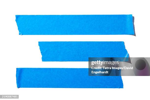 strips of blue paper tape on white background - striped stock pictures, royalty-free photos & images
