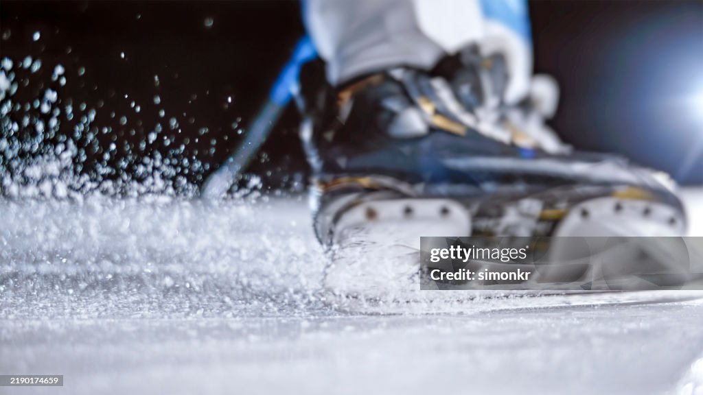 Ice Hockey Skate Action: Blades Cutting the Ice