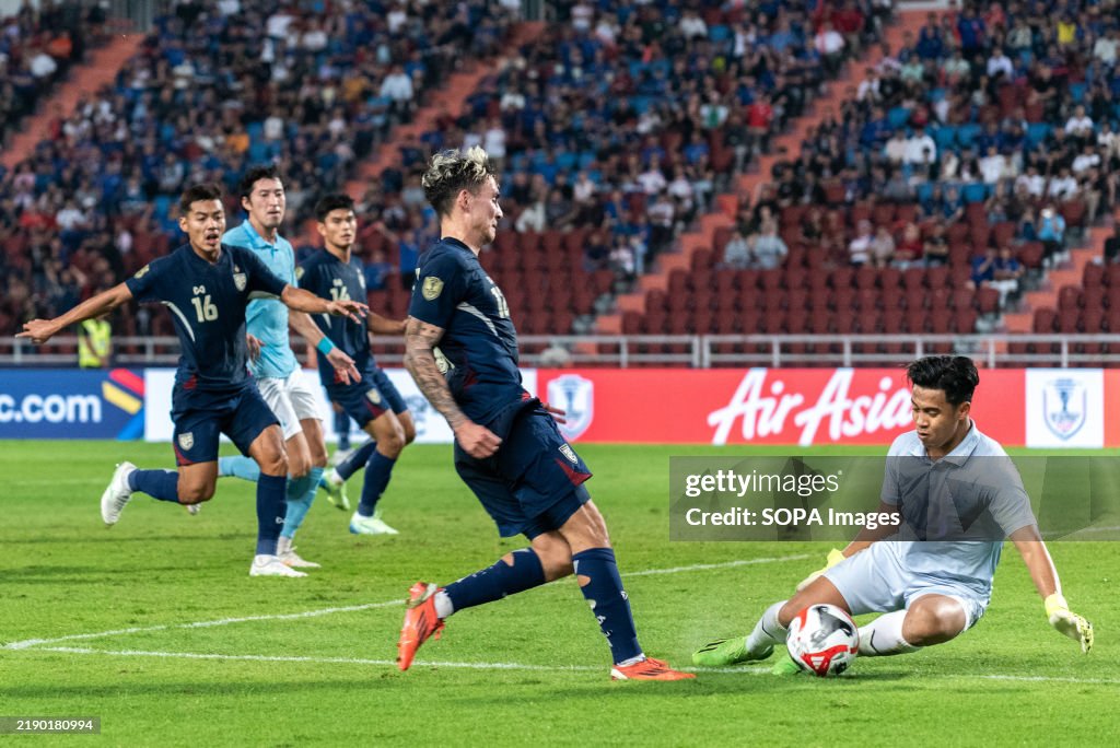 Sivhong Reth Ly Heng Reth of Cambodia and Nicholas Mickelson of Thailand seen in ...