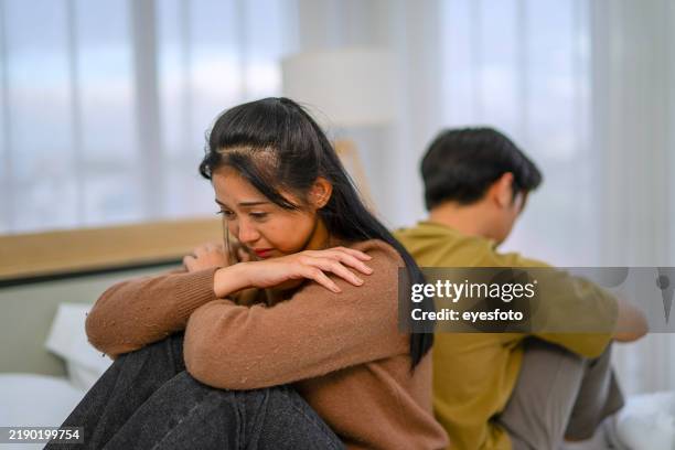 young couple is fighting in bedroom. - healing betrayal stock pictures, royalty-free photos & images