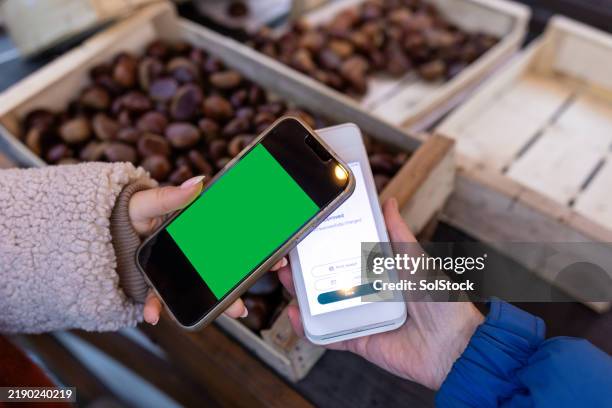 smartphone payments - roasted chestnuts stock pictures, royalty-free photos & images
