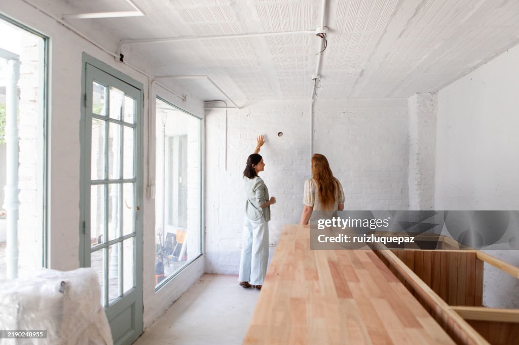 Female architects reviewing ideas for renovation project
