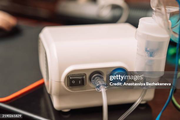 nebulizer standing on table near kid - nebulizer stock pictures, royalty-free photos & images