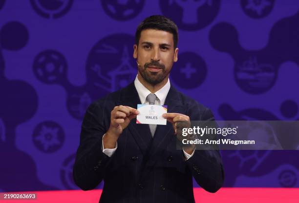 Sami Khedira pulls out the card of Wales during the UEFA Women's EURO 2025 Draw at Swiss Tech Convention Centre in Lausanne, Switzerland on December...