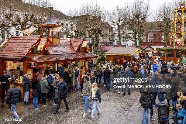 This general view shows visitors perusing stalls, attractions and catering establishments in the lead up to the Christmas Festival at 'The Magical...