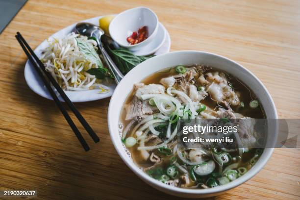 beef pho with lemon, thai basil, bean sprouts and chilli - vietnamese culture stock pictures, royalty-free photos & images