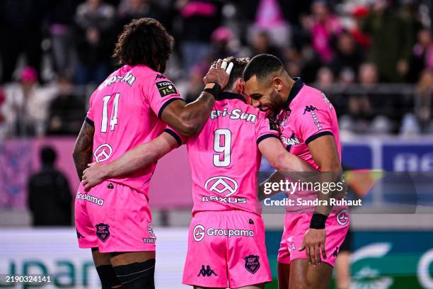 Brad WEBER of Stade Francais celebrates his try with Peniasi DAKUWAQA of Stade Francais and Joe MARCHANT of Stade Francais during the Top 14 match...