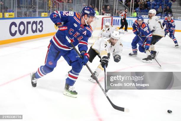 Evgeny Kuznetsov, known as Yevgeni Kuznetsov of SKA and Leonid Metalnikov of Admiral Hockey Club seen in action during the Hockey match, Kontinental...