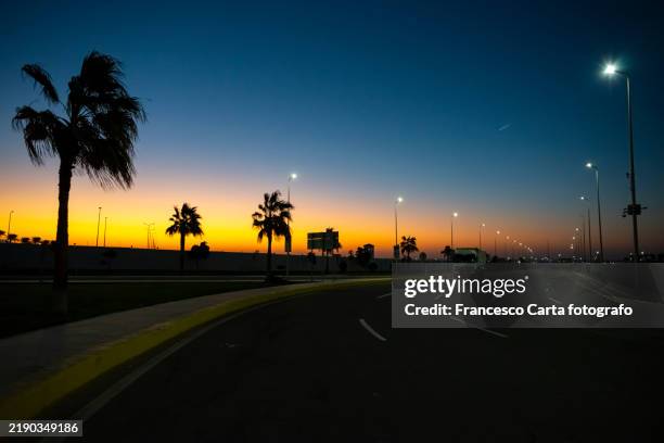 road through desert landscape late at dawn - sharm el sheikh stock pictures, royalty-free photos & images