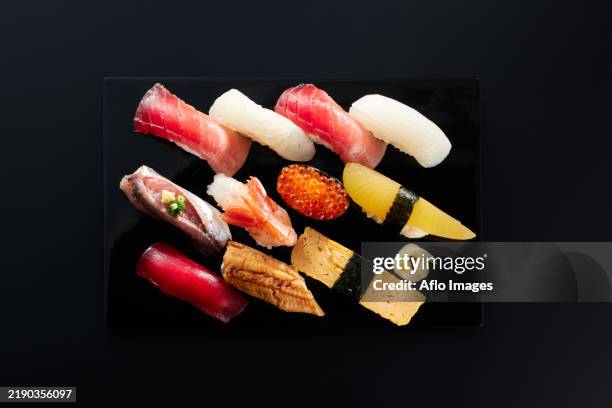 assorted sushi on a plate - viereckiger teller stock-fotos und bilder