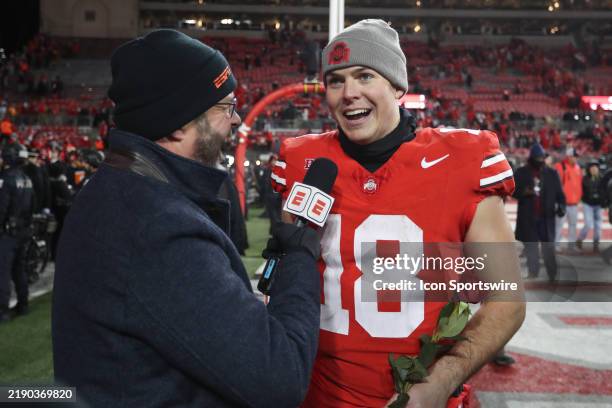 Ohio State Buckeyes quarterback Will Howard talks to the media after the college football playoff first round game against the Tennessee Volunteers...