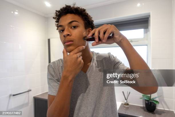 shaving with precision at home - male personal grooming stock pictures, royalty-free photos & images
