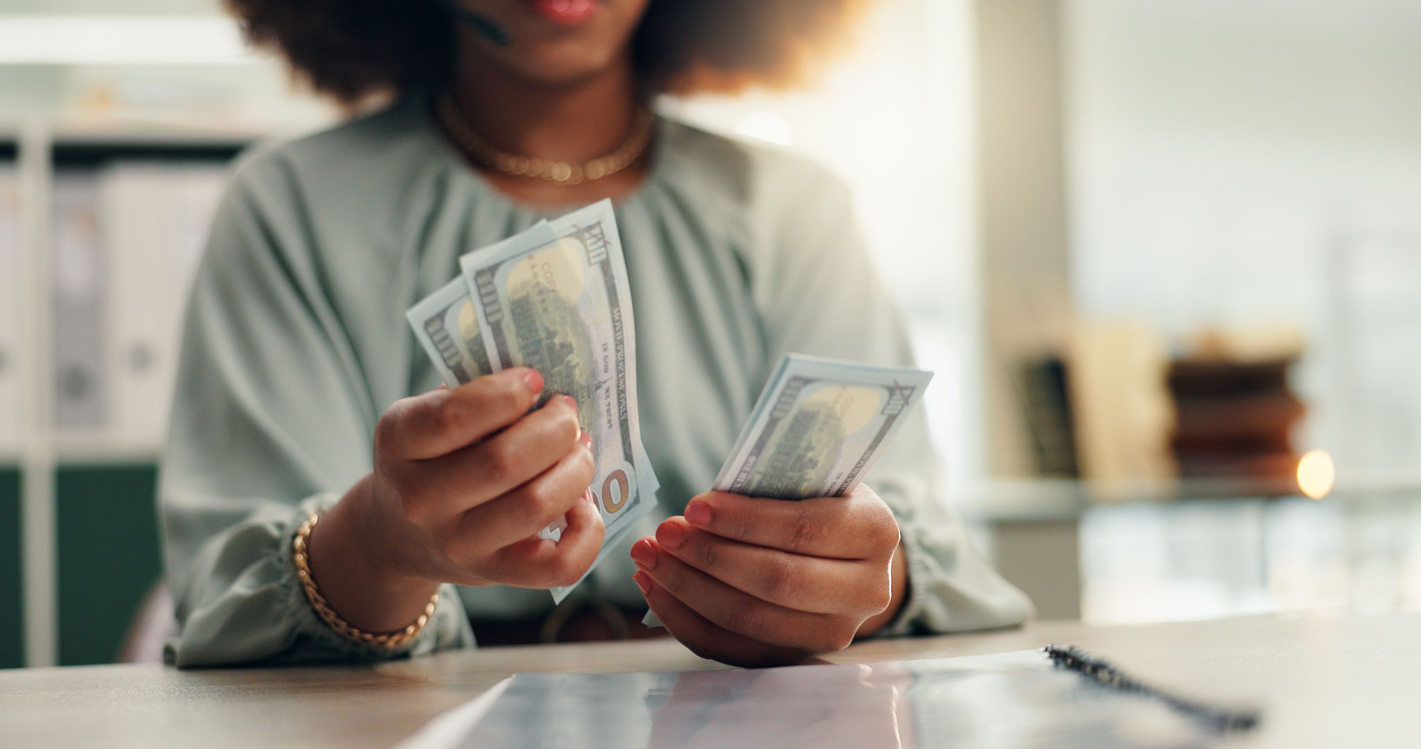 Business woman, hands or counting with cash for finance, profit or salary increase at office desk. Female person, accountant or employee with paper bills, financial savings or investment at workplace Business woman, hands or counting with cash for finance, profit or salary increase at office desk. Female person, accountant or employee with paper bills, financial savings or investment at workplace
