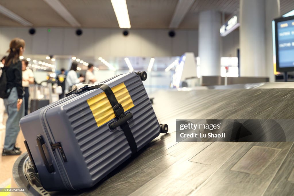 Luggage On Conveyor Belt At Airport