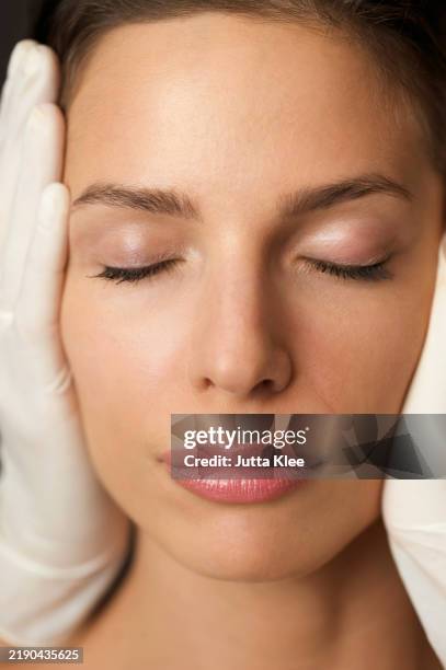 close up of a woman's face during a cosmetic examination - face lift stock pictures, royalty-free photos & images