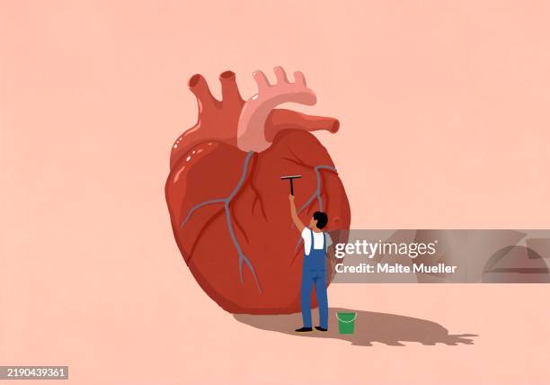 man with squeegee cleaning large heart - squeegee stock illustrations