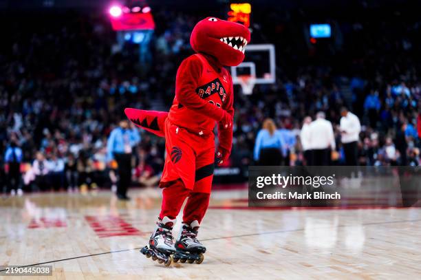 The Raptor, mascot of the Toronto Raptors performs during a break in play against the Chicago Bulls during the first half of their basketball game at...