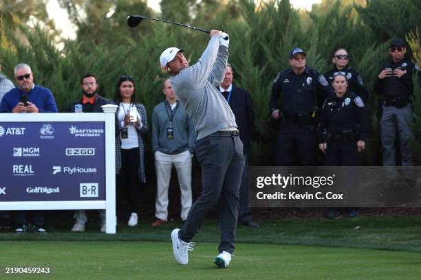 Scottie Scheffler of the PGA Tour plays his shot from the third tee during The Showdown: McIlroy and Scheffler v DeChambeau and Koepka at Shadow...