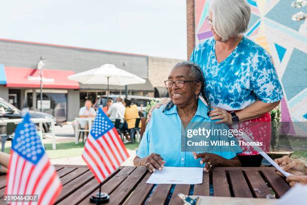 warm smiles at local bbq joint - american flag painting stock pictures, royalty-free photos & images