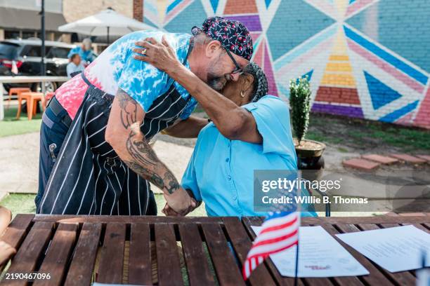 warm embrace at the bbq - black bandana shirt stock pictures, royalty-free photos & images
