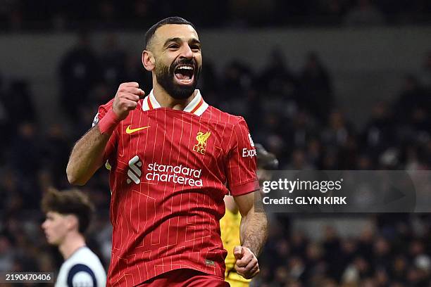Liverpool's Egyptian striker Mohamed Salah celebrates after scoring their fifth goal during the English Premier League football match between...