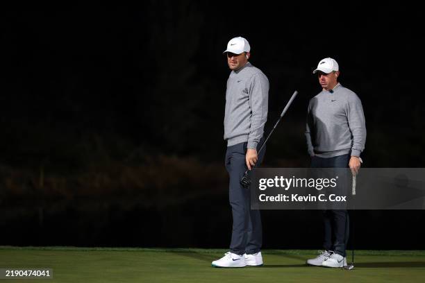 Scottie Scheffler and Rory McIlroy of the PGA Tour look on during The Showdown: McIlroy and Scheffler v DeChambeau and Koepka at Shadow Creek Golf...
