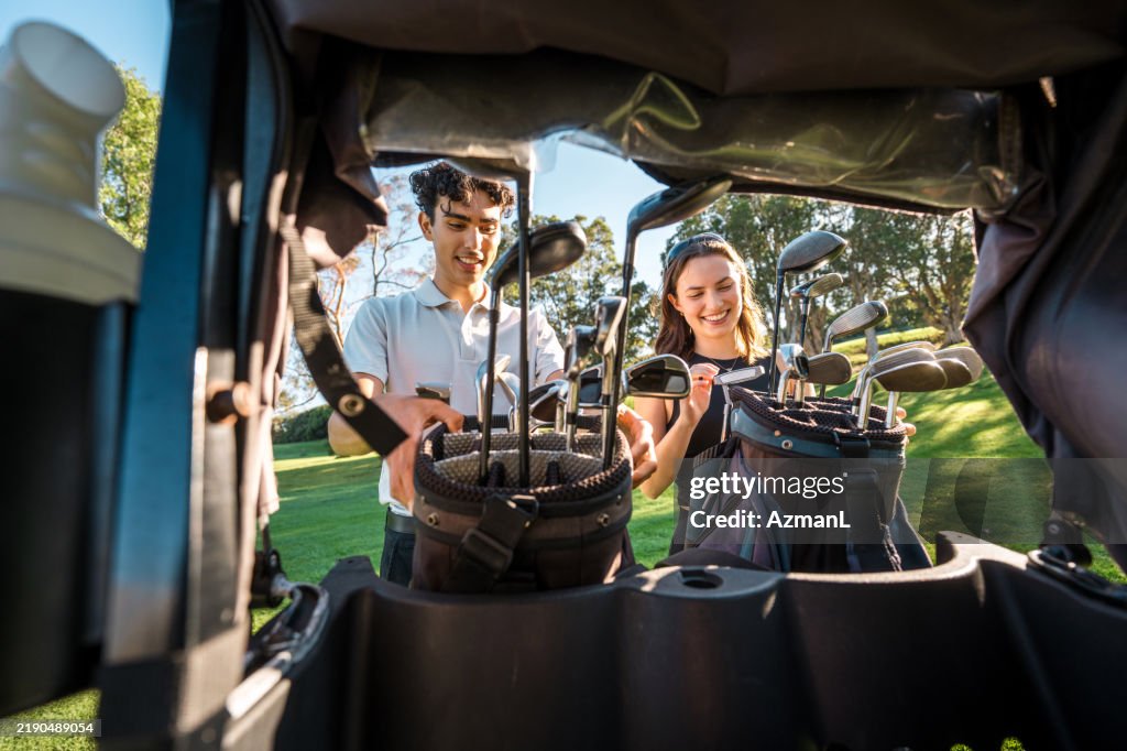 Excited Diverse Couple Gearing Up for Golf