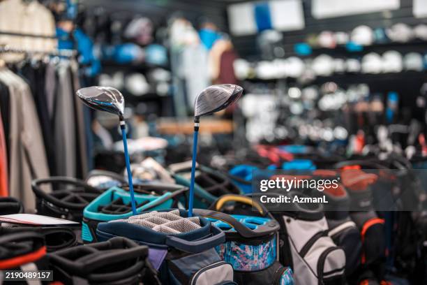 vibrant golf equipment display in modern retail space - golf pro stock pictures, royalty-free photos & images