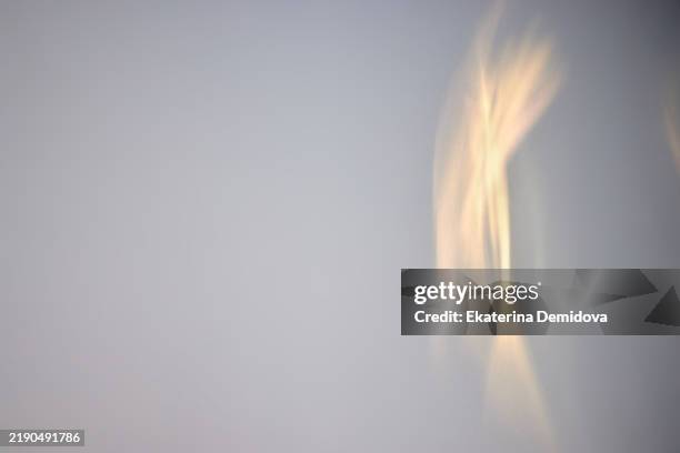 golden light reflections creating abstract shapes on a wall - ambient light stock pictures, royalty-free photos & images