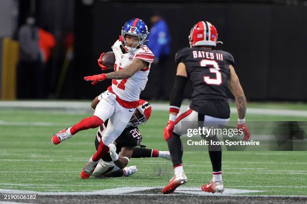 New York Giants wide receiver Wan'Dale Robinson gets wrapped up by Atlanta Falcons cornerback Dee Alford during the Sunday afternoon NFL game between...