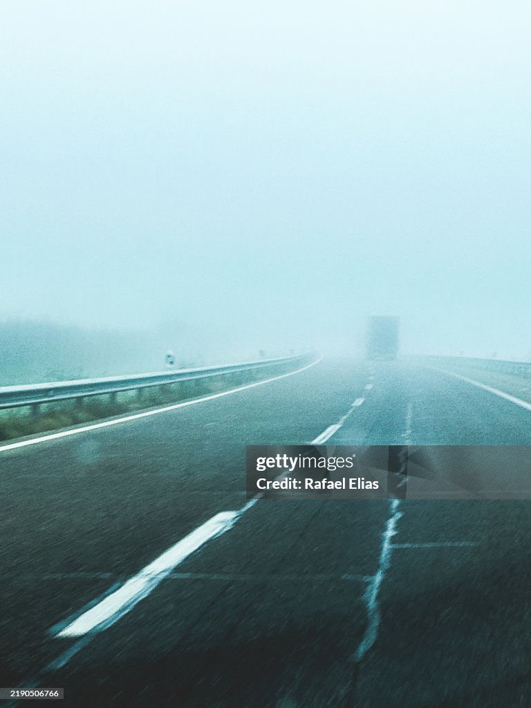 Driving along foggy road
