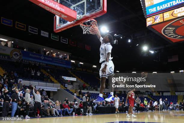 Rhode Island Rams guard Jaden House dunks the ball after time expired and conclusion of the 2024 college Basketball Hall of Fame Classic game between...