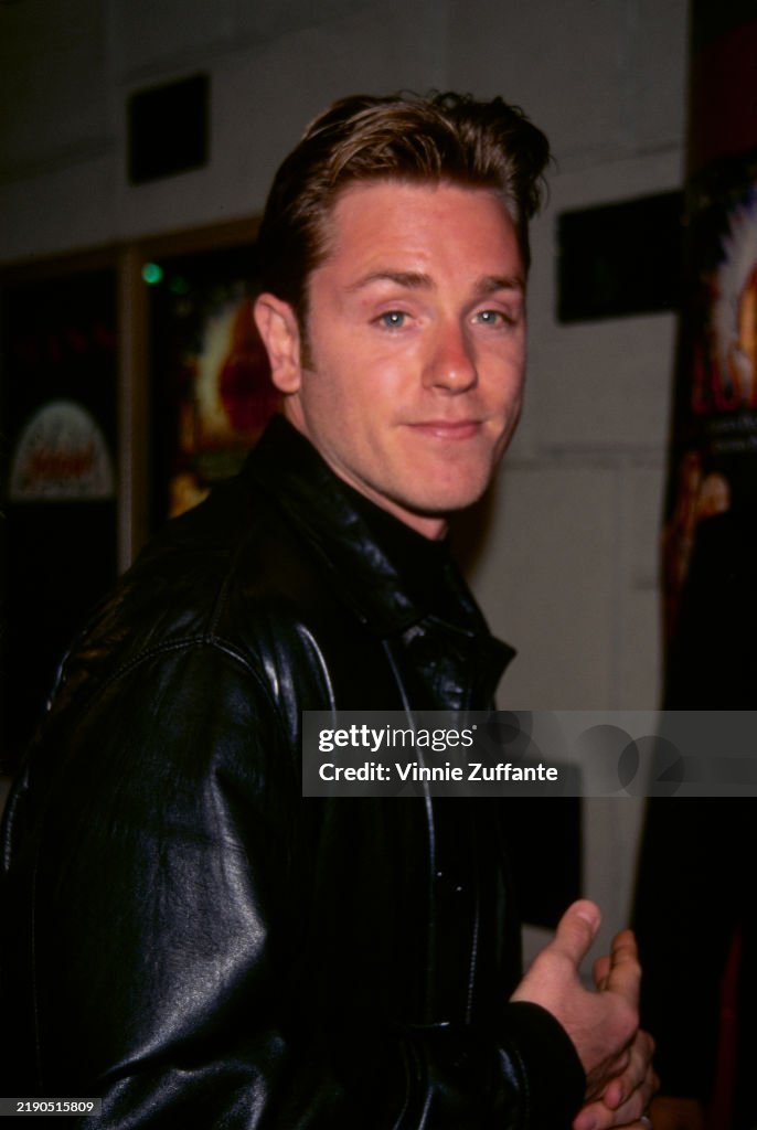 American actor Ron Eldard, wearing a black leather jacket, attends
