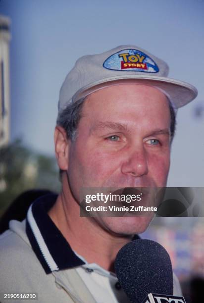 American media executive Michael Eisner, Walt Disney Company chief executive officer, wearing a 'Toy Story' baseball cap, attends the Hollywood...